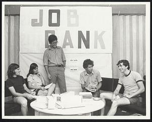 Job Bank Directors Douglas Miller and Martin Cohen, third and fourth from left, discuss work opportunities with job seekers, from left, Robert Burke, Carol Desausa, and Richard Barron.