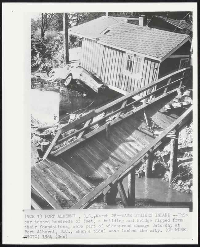 Wave Strikes Inland -- This car tossed hundreds of feet, a building and bridge ripped from their foundations, were part of widespread damage Saturday at Port Alberni, B.C., when a tidal wave lashed the city.