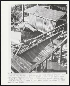 Wave Strikes Inland -- This car tossed hundreds of feet, a building and bridge ripped from their foundations, were part of widespread damage Saturday at Port Alberni, B.C., when a tidal wave lashed the city.