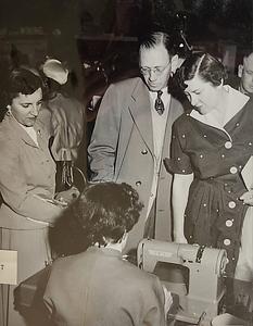 Gentleman and his wife at the 1955 business fair