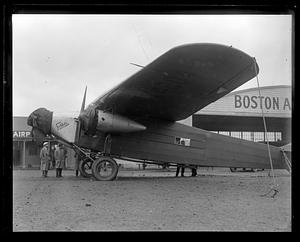 Byrd's South Pole plane before they put pontoons on it. East Boston Airport. B.A.C. hangar in back, a Fokker trimotor plane