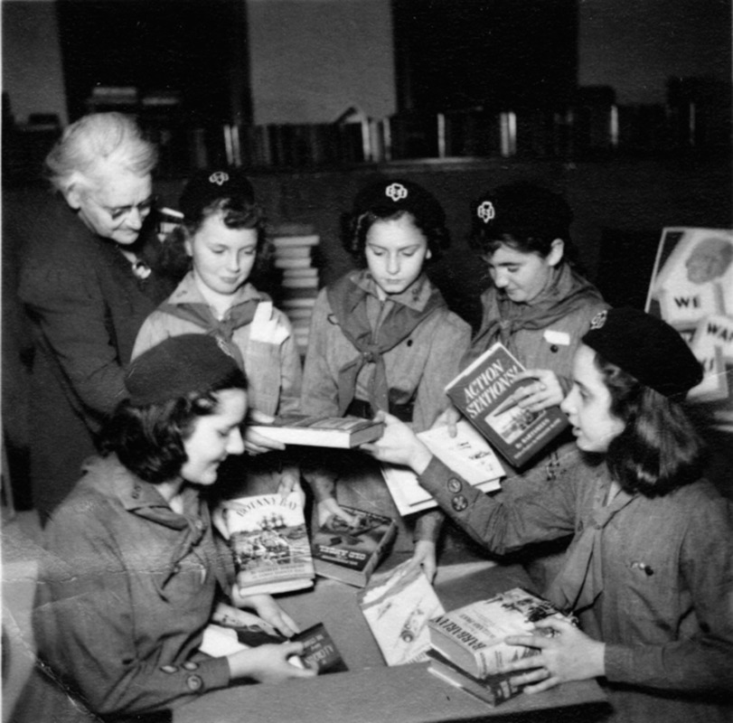 Library and Girls Scouts helping soldiers.