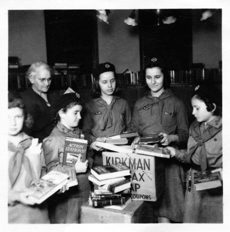 Library and Girls Scouts helping soldiers.