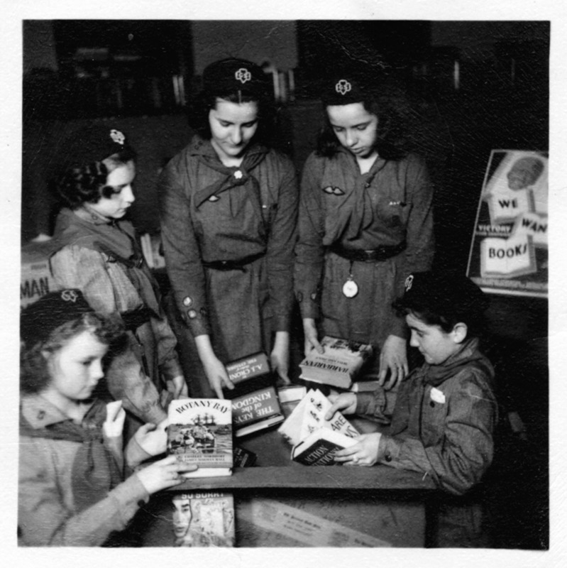 Library and Girls Scouts helping soldiers.