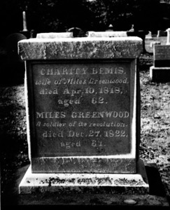 Gravestone of Charity Bemis and Miles Greenwood.