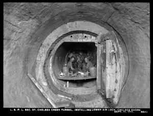 Distribution Department, Low Service Pipe Lines, Section 37, Chelsea Creek Tunnel, installing lower air lock, Chelsea shore, Chelsea, Mass., Sep. 15, 1910