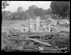 Distribution Department, Low Service Pipe Lines, lowering 20-inch main for dredging Mystic River near High and Medford Streets, Arlington; Medford, Mass., Sep. 30, 1910