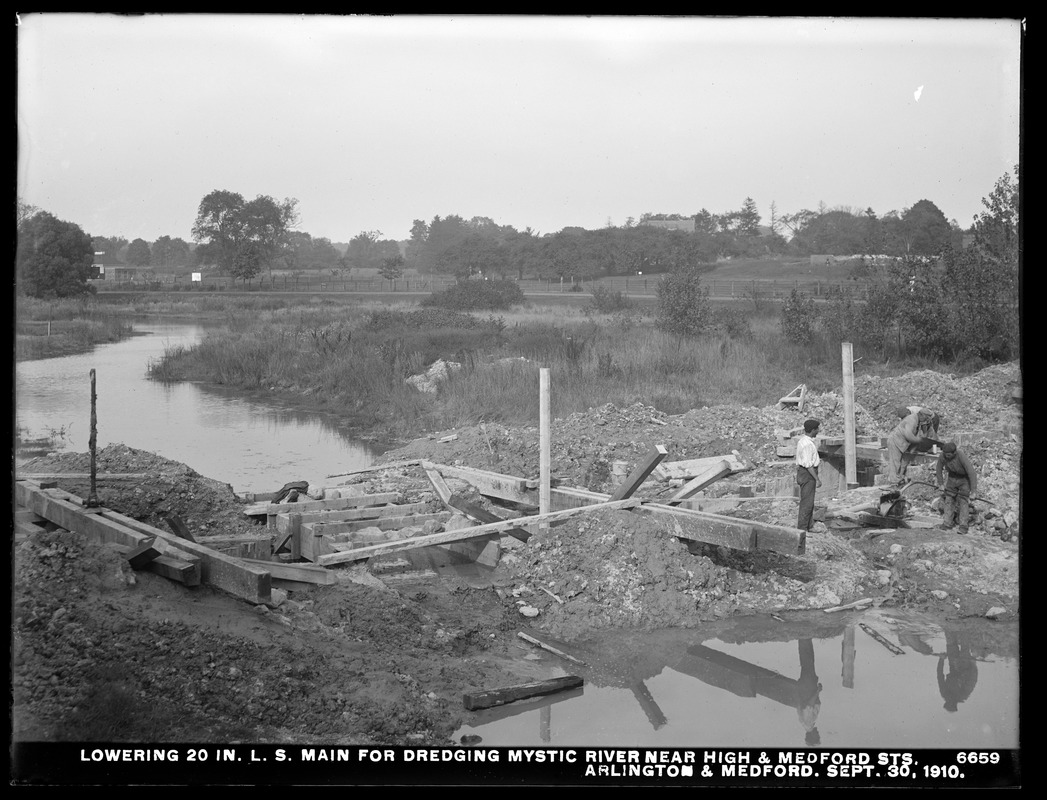 Distribution Department, Low Service Pipe Lines, lowering 20-inch main for dredging Mystic River near High and Medford Streets, Arlington; Medford, Mass., Sep. 30, 1910