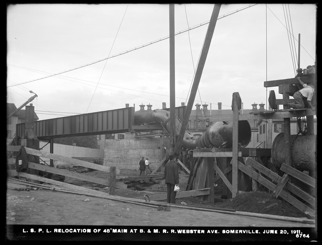Distribution Department, Low Service Pipe Lines, relocation of 48-inch main at Boston & Maine Railroad, Webster Avenue, Somerville, Mass., Jun. 20, 1911