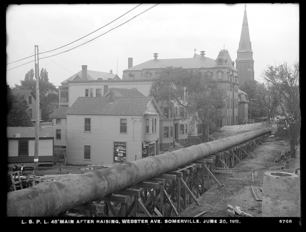 Distribution Department, Low Service Pipe Lines, 48-inch main after raising, Webster Avenue, Somerville, Mass., Jun. 20, 1911