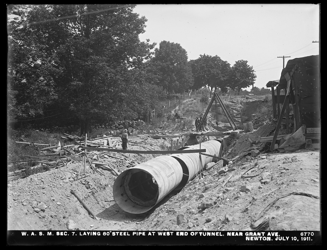 Distribution Department, Weston Aqueduct Supply Mains, Section 7, laying 80-inch steel pipe at west end of tunnel, near Grant Avenue, Newton, Mass., Jul. 10, 1911