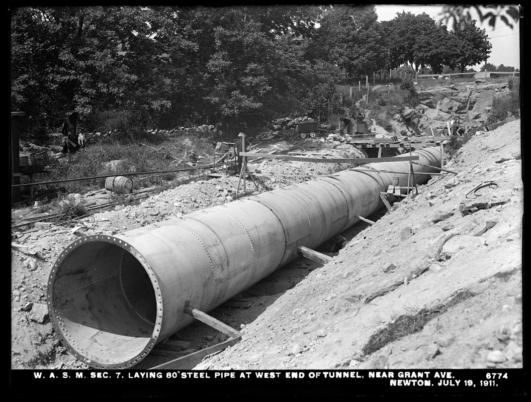 Distribution Department, Weston Aqueduct Supply Lines, Section 7, laying 80-inch steel pipe at west end of tunnel, near Grant Avenue, Newton, Mass., Jul. 19, 1911