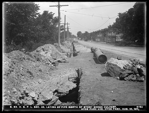 Distribution Department, Southern Extra High Service Pipe Lines, Section 40, laying 20-inch pipe north of Stony Brook culvert, Hyde Park Avenue, Hyde Park, Mass., Aug. 10, 1911