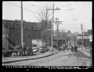Distribution Department, Southern High Service Pipe Lines, Section 39, trench for temporary 24-inch pipe under Boston Elevated Railway tracks, Walk Hill Street, West Roxbury, Mass., Nov. 14, 1911