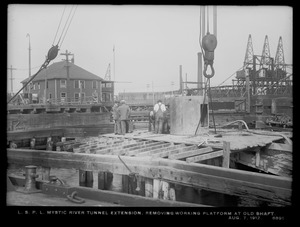 Distribution Department, Low Service Pipe Lines, Mystic River tunnel extension, removing working platform at old shaft, Charlestown, Mass., Aug. 7, 1912