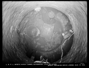 Distribution Department, Low Service Pipe Lines, Mystic River tunnel extension, looking down shaft, showing brick lining, Charlestown, Mass., Aug. 16, 1912