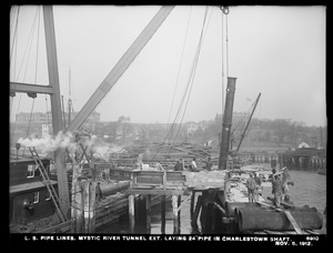 Distribution Department, Low Service Pipe Lines, Mystic River tunnel extension, laying 24-inch pipe in Charlestown shaft, Charlestown, Mass., Nov. 5, 1912
