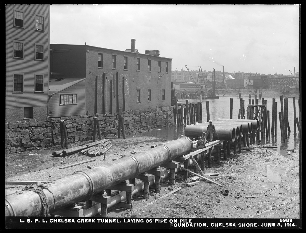 Distribution Department, Low Service Pipe Lines, Chelsea Creek Tunnel, laying 36-inch pipe on pile foundation, Chelsea shore, Chelsea, Mass., Jun. 3, 1914