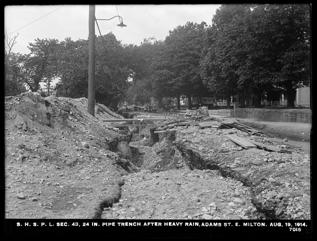 Distribution Department, Southern High Service Pipe Lines, Section 43, 24-inch pipe trench after heavy rain, Adams Street, East Milton, Milton, Mass., Aug. 19, 1914