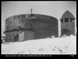 Distribution Department, Southern Extra High Service Bellevue Reservoir, riveting east side of steel tank, Bellevue Hill, West Roxbury, Mass., Dec. 23, 1914