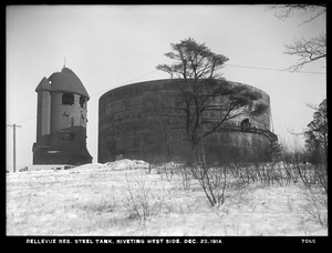 Distribution Department, Southern Extra High Service Bellevue Reservoir, riveting west side of steel tank, Bellevue Hill, West Roxbury, Mass., Dec. 23, 1914