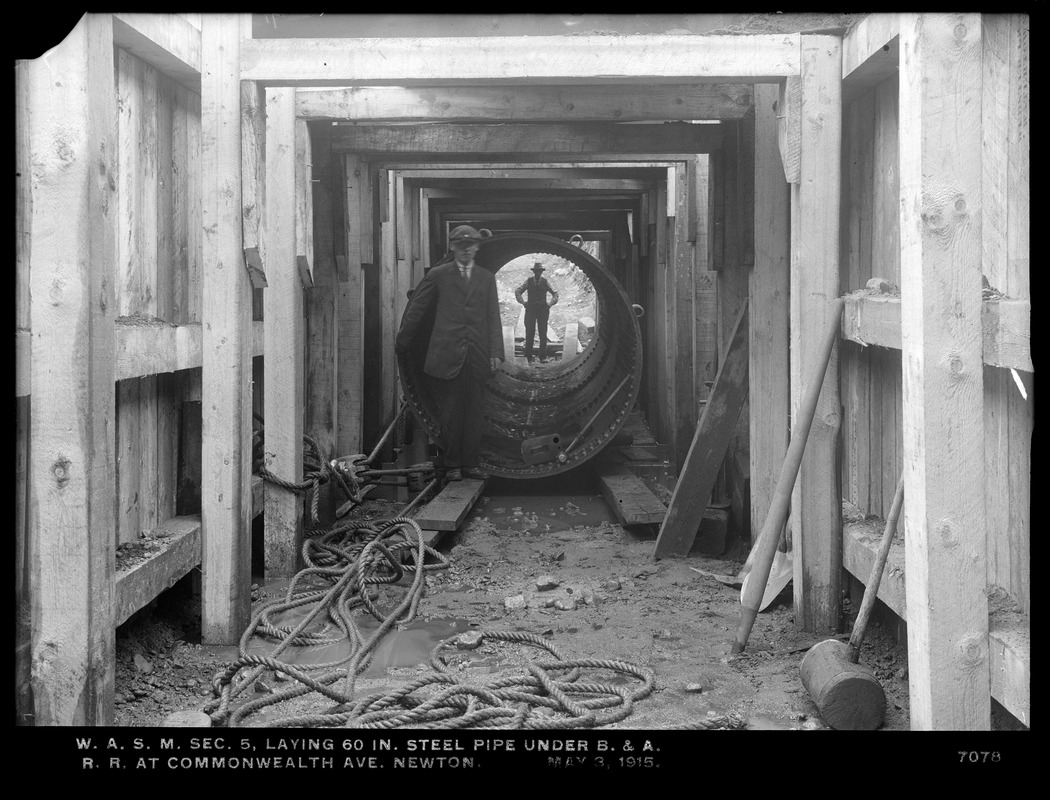 Distribution Department, Weston Aqueduct Supply Mains, Section 5, laying 60-inch steel pipe under Boston & Albany Railroad at Commonwealth Avenue, Newton, Mass., May 3, 1915