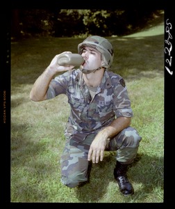Saddle, GI drinking out of canteen