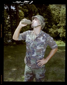 Saddle, GI drinking out of canteen