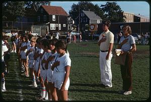 Track team with hands over hearts, Somerville