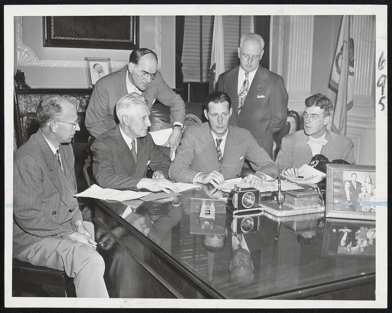 OPA Officials Confer with Governor-Local OPA problems were the subject of this meeting of OPA officials today with Gov. Tobin in the State House. Left to right: Fred J. Murkland, information officer; Eldon C. Shoup, regional administrator; the Governor; Edgar J. Driscoll, regional rent executive, and standing, J. Frederick Harkins, regional rent attorney, and William F. Riley, rea rent director.