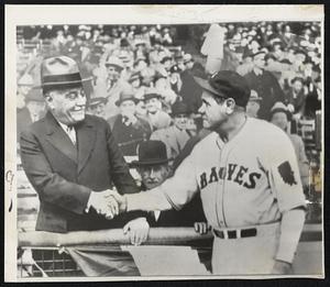 Babe Ruth shakes Jacob Ruppert's hand
