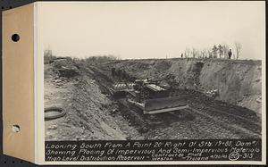 Contract No. 80, High Level Distribution Reservoir, Weston, looking south from a point 20 feet right of Sta. 19+80, dam 1 showing placing of impervious and semi-impervious materials, high level distribution reservoir, Weston, Mass., Apr. 30, 1940