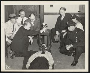 New Life Saving Equipment-Albert Ingram, business manager of the Melrose Hospital, presented both the Melrose and Wakefield Police departments with portable emergency oxygen carriers for use in police ambulances. Mr. Ingram demonstrates while Melrose police officers observe the procedure. Left to right are Sgt. John Parker, Patrolman Joseph Botto, Sgt. Leo Murray, Sgt. Joseph Curran, Patrolman Thomas Ward and Patrolman Lee Scenna.