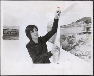 Susan Shatter straighten one of her works