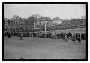 Crowd surrounding a football field