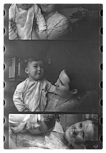 Maude Sanromá holding a child