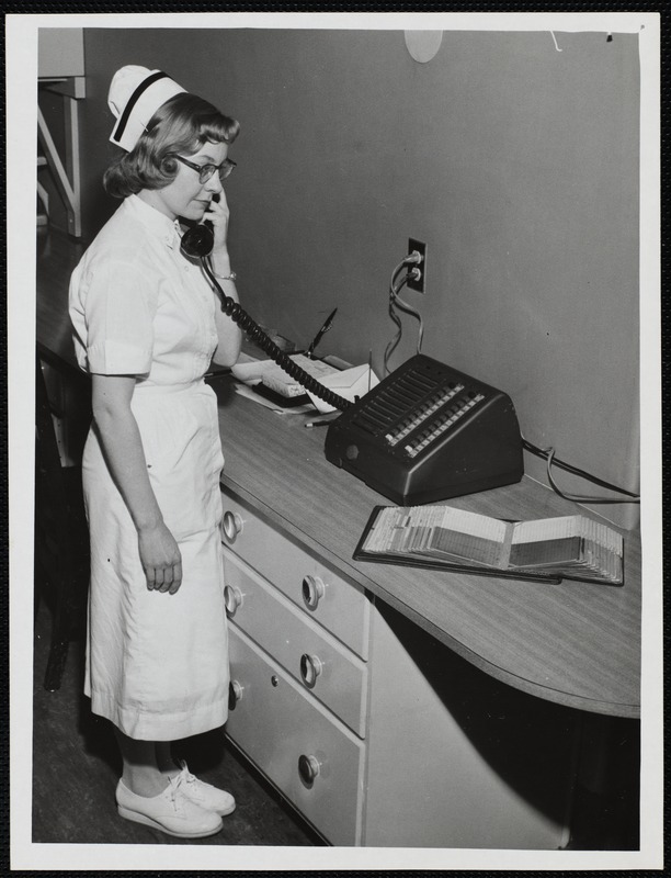 Faulkner Hospital nurse talking on telephone