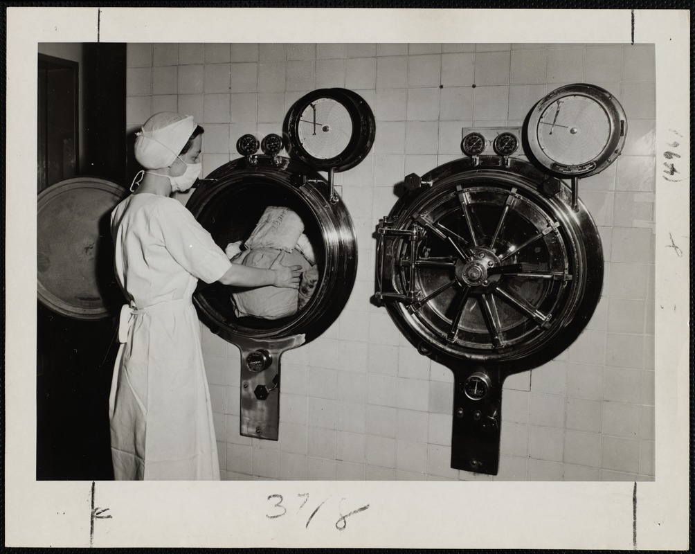 Faulkner Hospital operating room worker loading the autoclaves