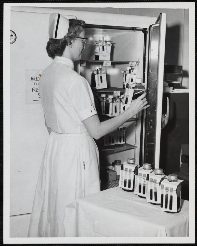 Nurse at Faulkner Hospital laboratory refrigerator