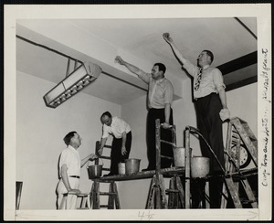 Four Faulkner Hospital volunteers cleaning ceiling