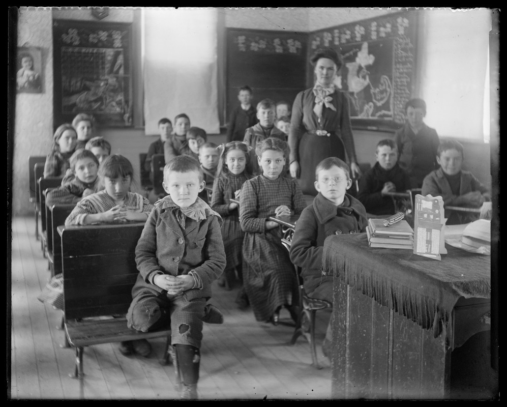 School mistress with her class seated at their desks