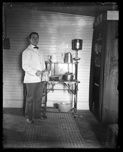 Young man holding coffee pot