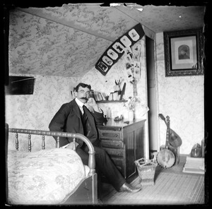 Augustus Martin in bedroom - many artifacts in evidence