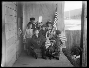 Children's group with instruments and flags