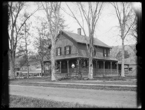 House with woman on porch