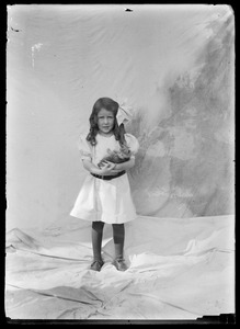 Little girl with kitten: studio portrait