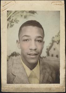 Portrait of a young man wearing a suit