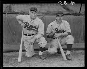 Philadelphia Phillies players Johnny Moore and Dolph Camilli kneeling with bats