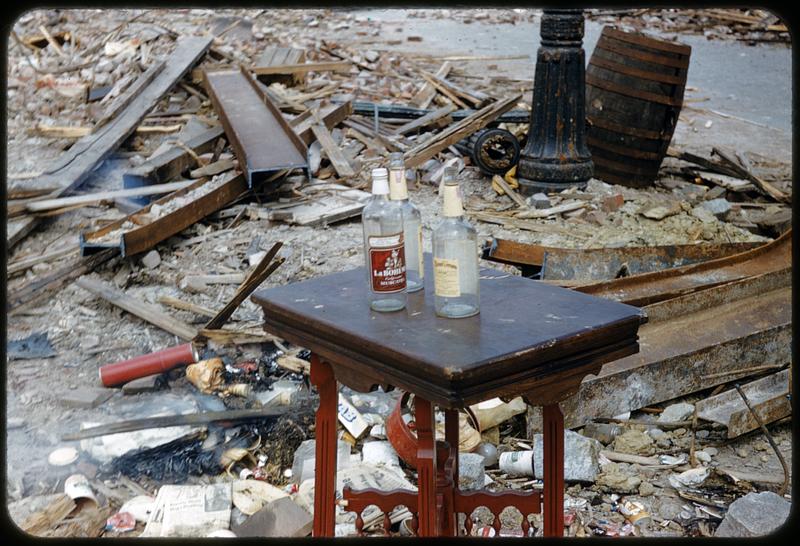 Empty bottles on table in debris, West End, Boston