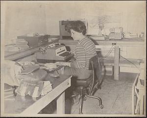 Woman employee at typewriter
